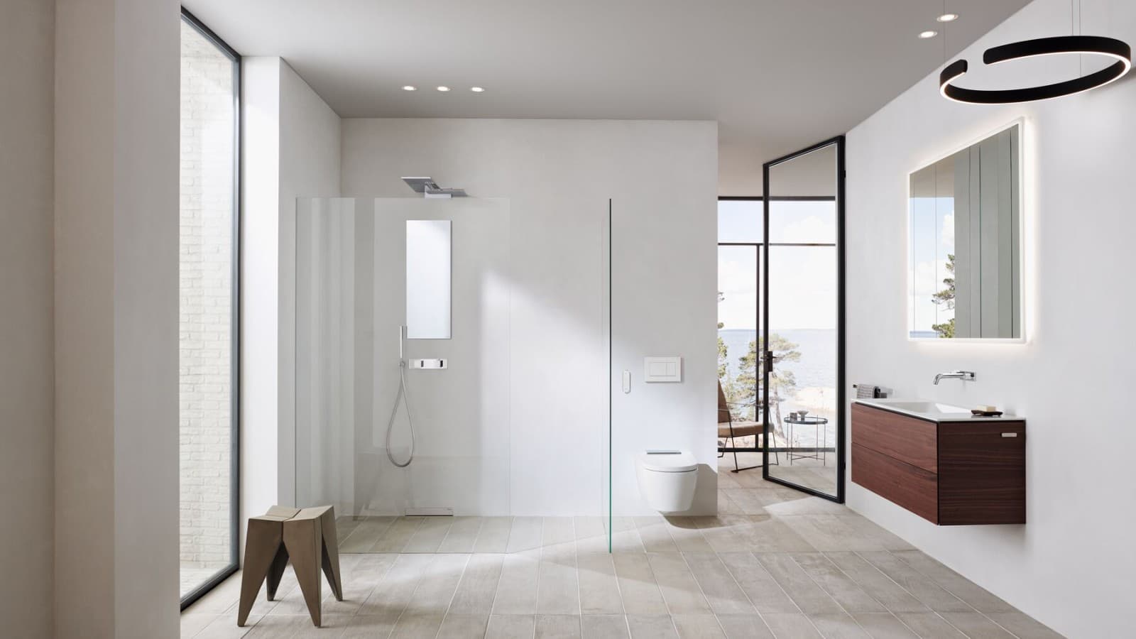 Suihkuseinä avoimessa suihkutilassa lisää avaruutta kylpyhuoneeseen. Suihkuseinä avoimessa suihkutilassa lisää avaruutta kylpyhuoneeseen.